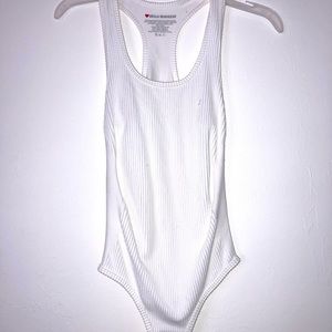White body suit, never worn before.